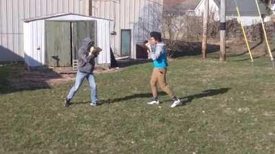 me (blue hoodie khakis) vs my friend