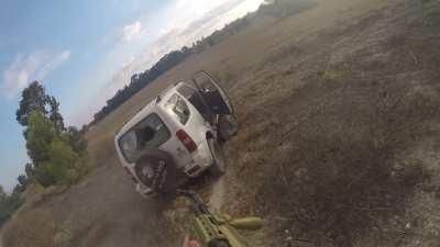 Hamas militants chasing down a civilian car and killing the occupants in southern Israel, October 7th.