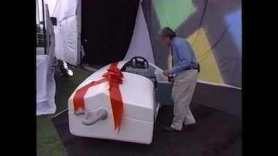 Jay Leno driving a mouse car at the windows 95 launch event