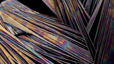 Growing some crystals on a microscope slide, while lit with cross-polarized light.