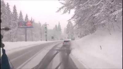 Impatient driver overtakes on a icy road