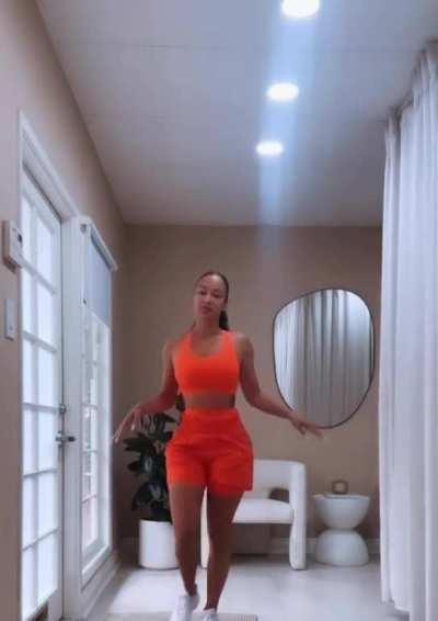 Draya Michele sexy orange summer outfit.