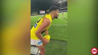 Spectators taunt a football player to miss. But he nails the goal.