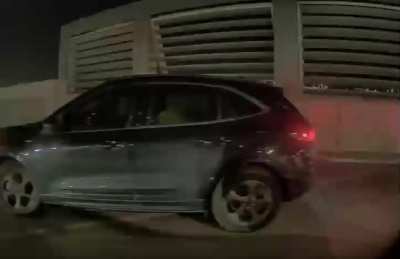 Driver going up a one-way ramp towards me | Disney Springs garage