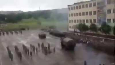 Driving a tank close to humans. Bottom right of the squad is where you want to be watching.