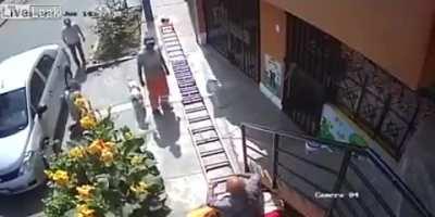 Man survives a high fall from a ladder when an old man jiggles it