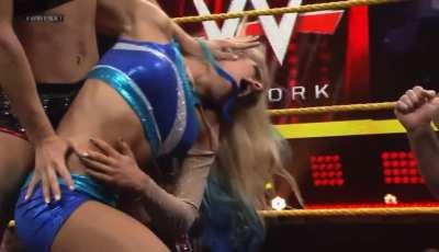Charlotte punches Alexa’s stomach knocking the wind out of her!
