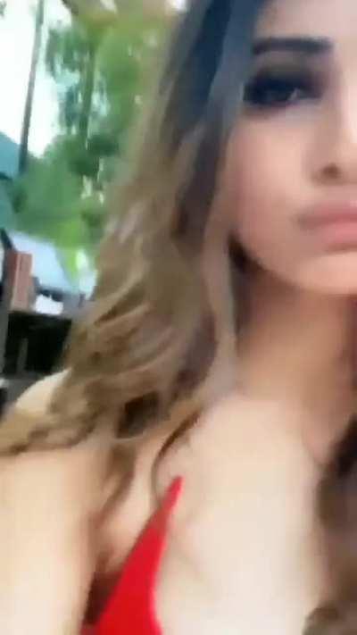 Mouni Roy's cleavage in a sexy red dress