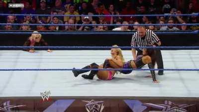 Layla uses her muscular legs to weaken the thin abdomen of the blonde Barbie doll