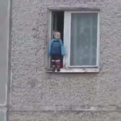 Kid just standing in the window