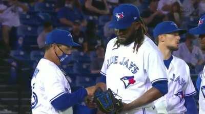 Rafael Dolis shakes his manager's hand instead of handing him the baseball
