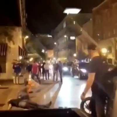 Team of assholes punch someone's bike
