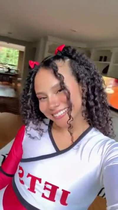 Latina curls and smiles