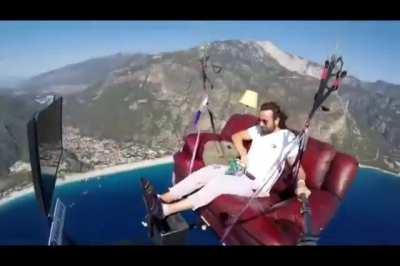 Man attempts to paraglide with couch