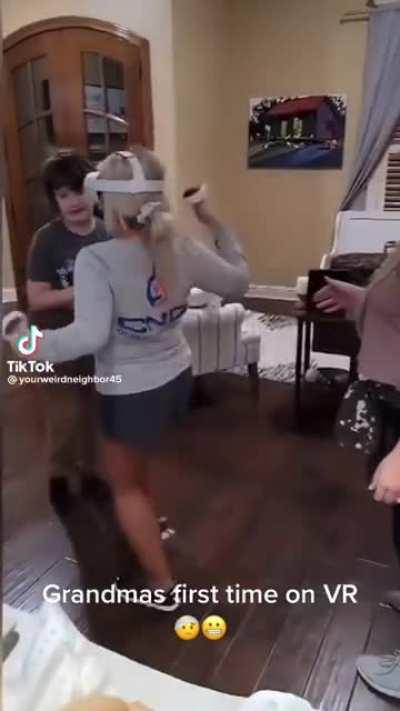 Grandma accidentally levels her grandson while trying VR for the first time
