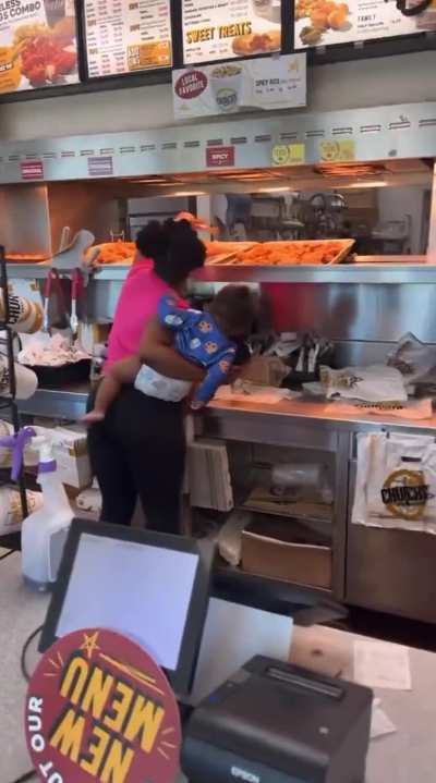 Woman didn't want to wait for her order to be fixed at Church's, so she just went behind the counter and did it herself.