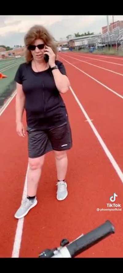 Karen calls the cops on boy riding his bike on the track