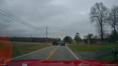 Impatient idiot in a truck almost hits turning car