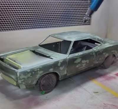 Man restores model car