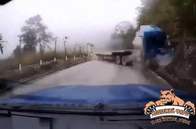 Truck driver gets ejected after crashing.