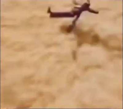 Two dudes flying over the field joyfully