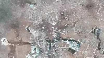 video showing a russian soldiers being hit precisely on the head by a drone drop munition. [music from source]