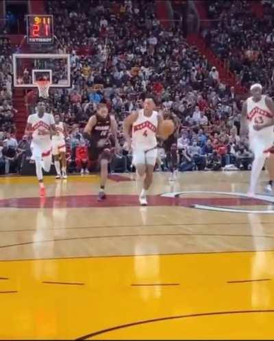 NBA player one second before he crashes into a person in the audience