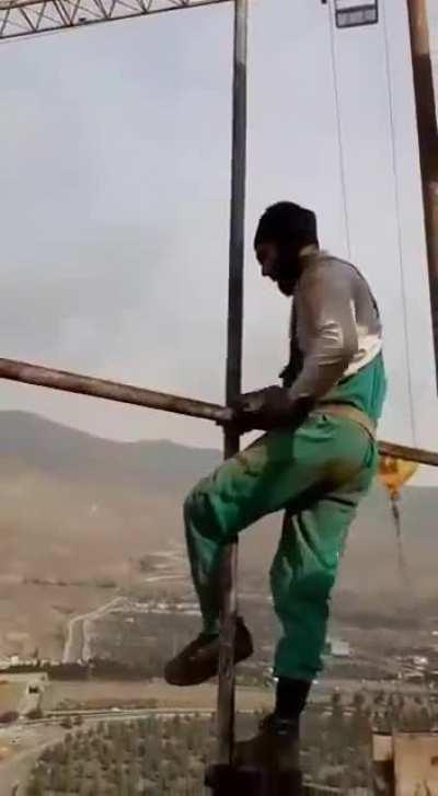 Working in terrifying hight without safety straps and harness.