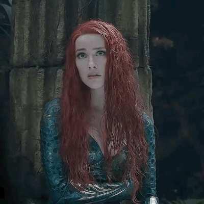 Amber Heard listening to studio execs talking about what she can do to stay on as Mera...