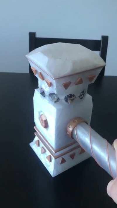 I designed and printed a DND Warhammer than launches my dice when I slam the table!