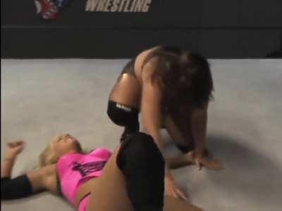 Older wrestler squeezes the life out of the poor blonde, rips her arm out of her socket and forces her to tap out to a crossface