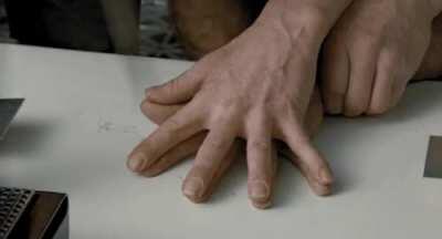 In Aliens (1986), the knife trick scene was originally going to be done by Bishop (Lance Henrickson) alone. Henrickson suggested to director James Cameron to have Hudson's (Bill Paxton) hand put on top of his, and Cameron agreed. Everyone on set was told 