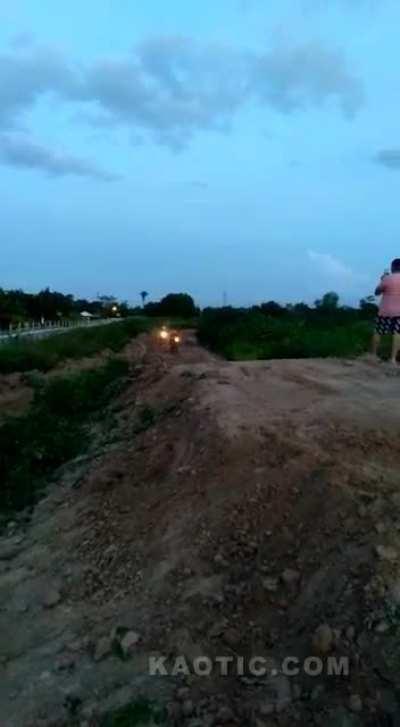 Lying down in front of a moving motorcycle
