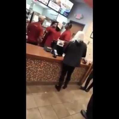 Racist woman gets bodyslammed by fast food worker.