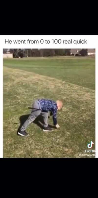 Kid plays golf