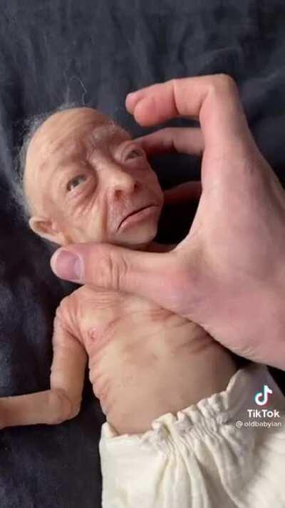 Chris and Zach playing with their newborn