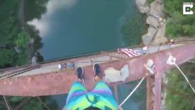 Daring jump off a really high bridge