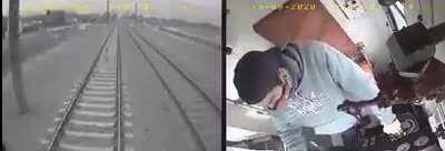 Argentine kid stands on train tracks