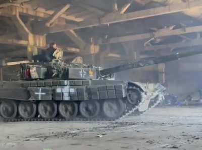 RU POV - Ukrainian tank with spray painted Balkenkreuz used by the Wehrmacht and Azov symbols