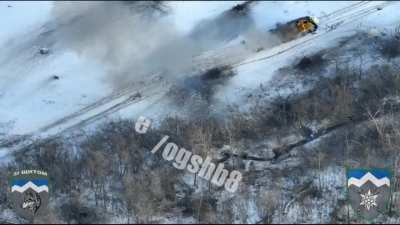A Ukrainian soldier blows up a Russian armored vehicle with the help of a grenade launcher from a close range