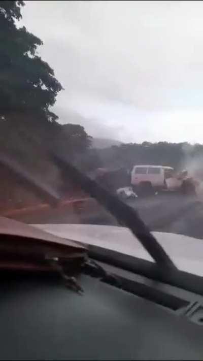 Truck Loses Breaks and Smashes Against Ambulance. Guy in Red Reported as Dead.