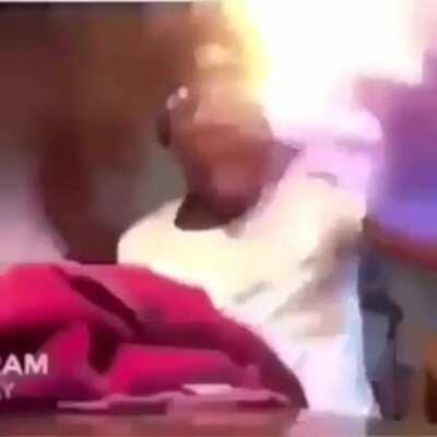 man waxes and lights his hand on fire