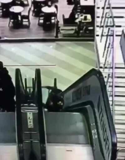 Unattended kids fall down escalator