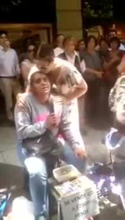 Blind lady was singing a famous song when suddenly the original singer appears.