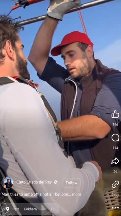 Guy tries to jump out of a hot air balloon