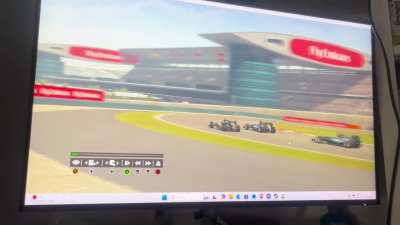 F1 Racing. (I am the car overtaking both the Mercedes)