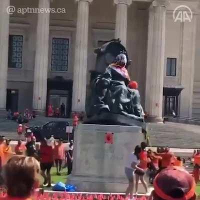 Defaced statue of Queen Victoria brought down by a mob on Canada Day