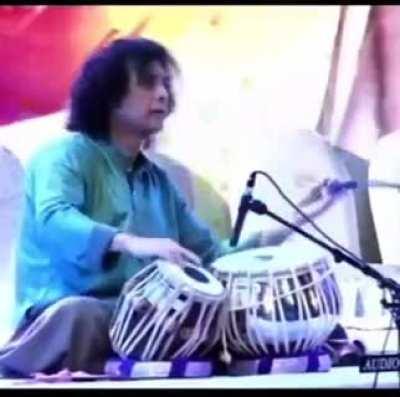 Zakir Hussain dealing with equipment malfunction with grace.