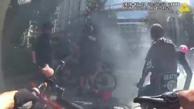 Man lures Seattle PD by blocking a camera with an umbrella. 