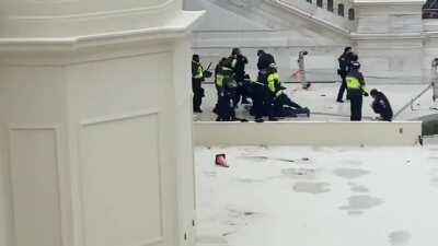 Cops beating the shit out of someone